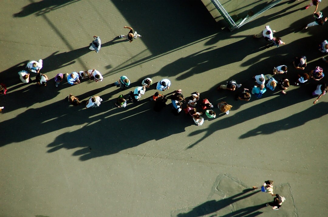 People standing in an orderly queue outdoors